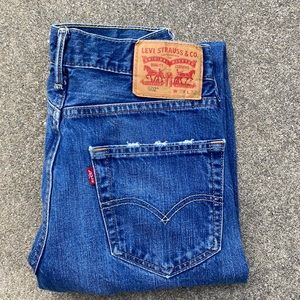 Levi Strauss & Co. mens 502 distressed jeans.